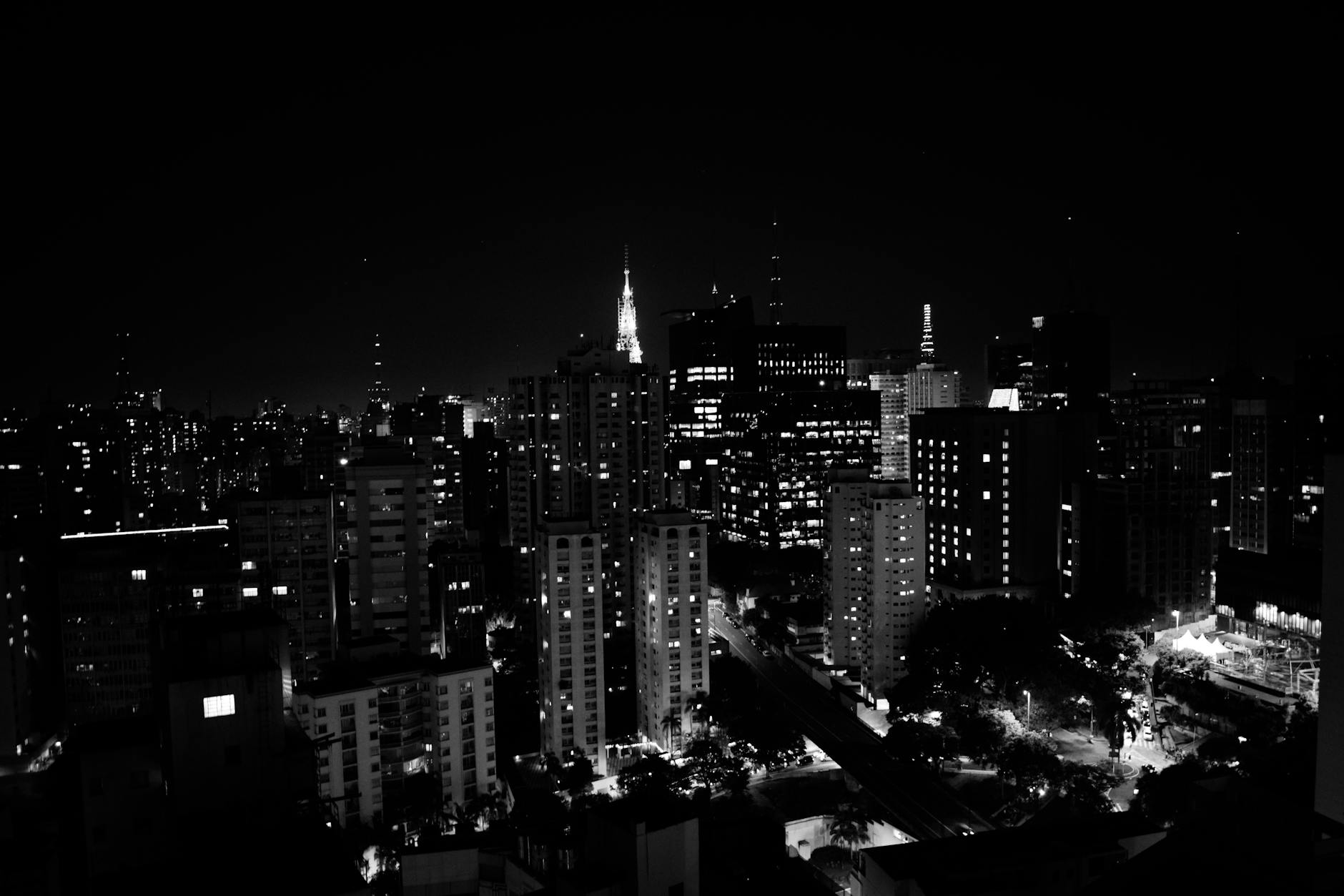 Stunning black and white nightscape of São Paulo's skyline with illuminated skyscrapers.